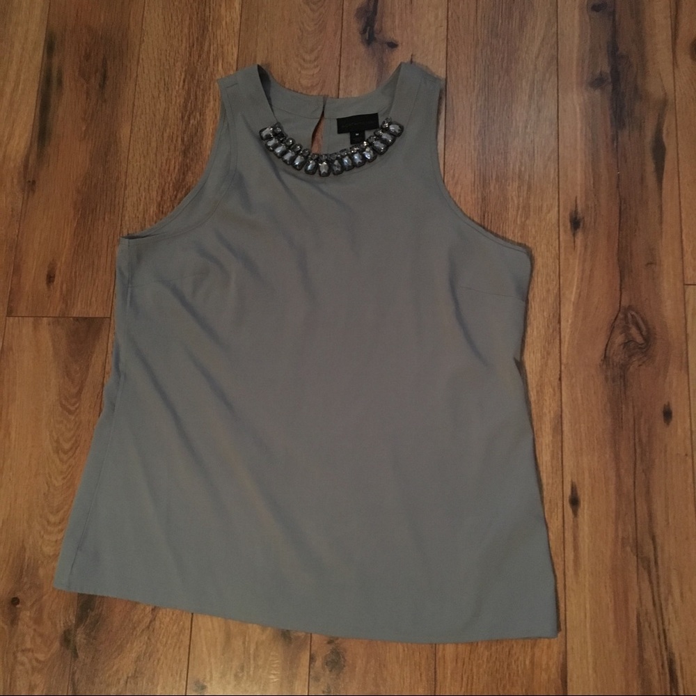 Gray, sleeveless blouse with necklace at neck
